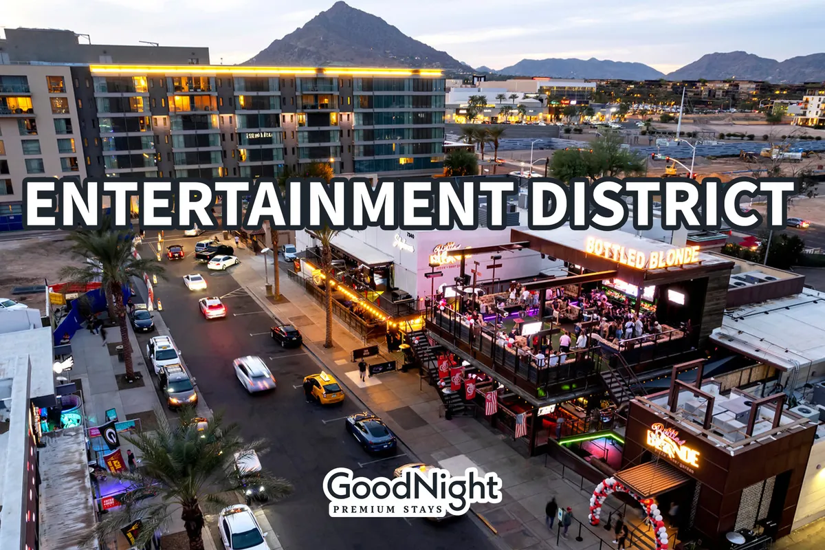Vibrant exterior image of the nearby entertainment district, including the Bottled Blonde bar, signage, street activity, and surrounding mountains. The lively ambiance signals proximity to Scottsdale’s renowned dining and nightlife options.